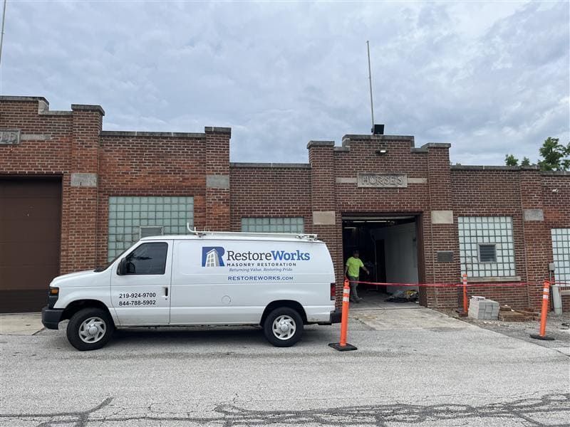 RestoreWorks masonry restoration van parked in front of Meeker Hall at the Lake County Fairgrounds