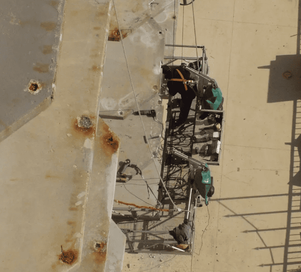 RestoreWorks crew preparing concrete balcony restoration work at a multi-housing property.