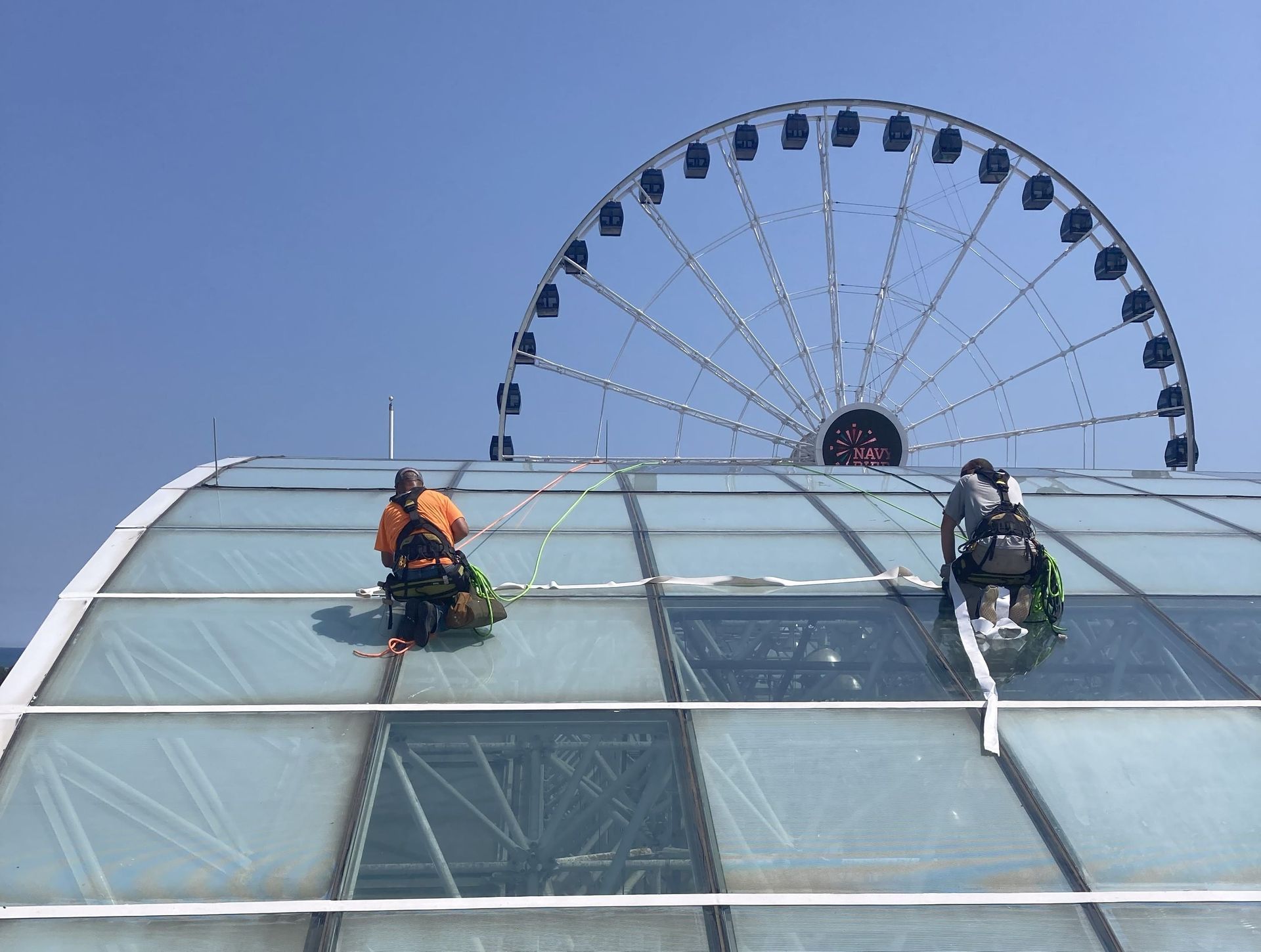 Rope access crew sealing the Crystal Garden glass dome at Navy Pier.
