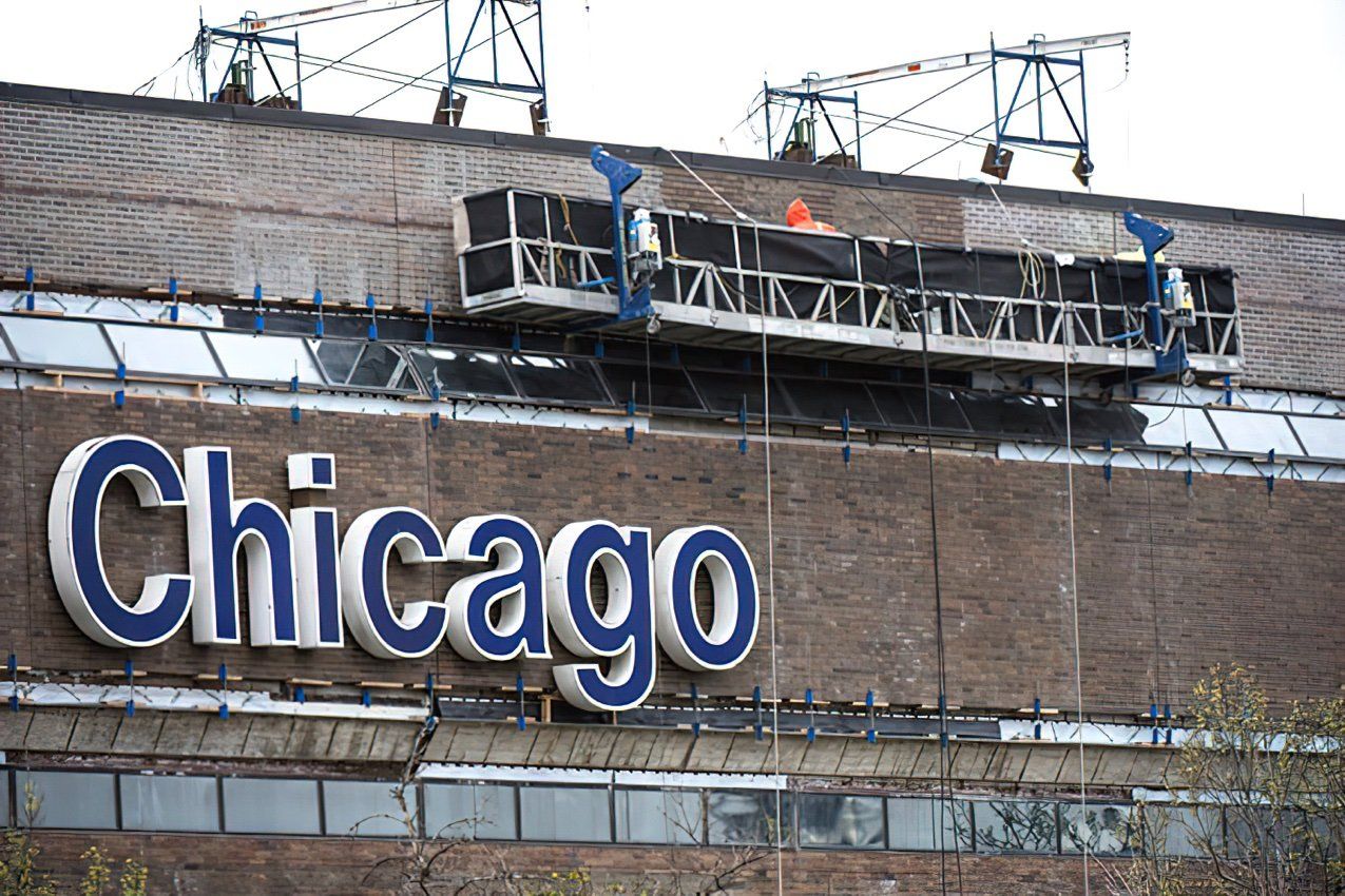 A large chicago sign on a brick building at university of Illinois-Chicago