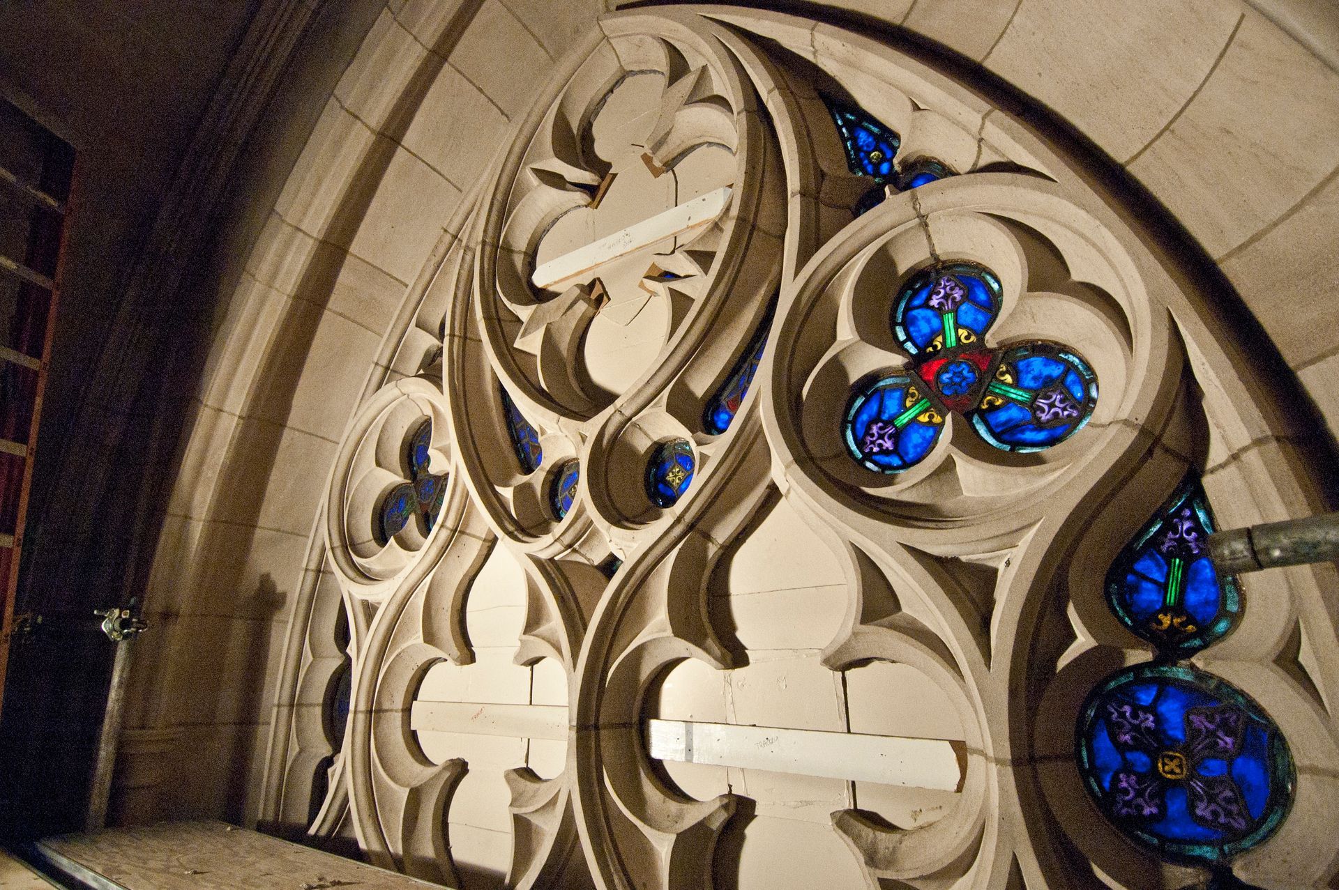 Interior Limestone cleaning around stained glass window in Duke's Chapel