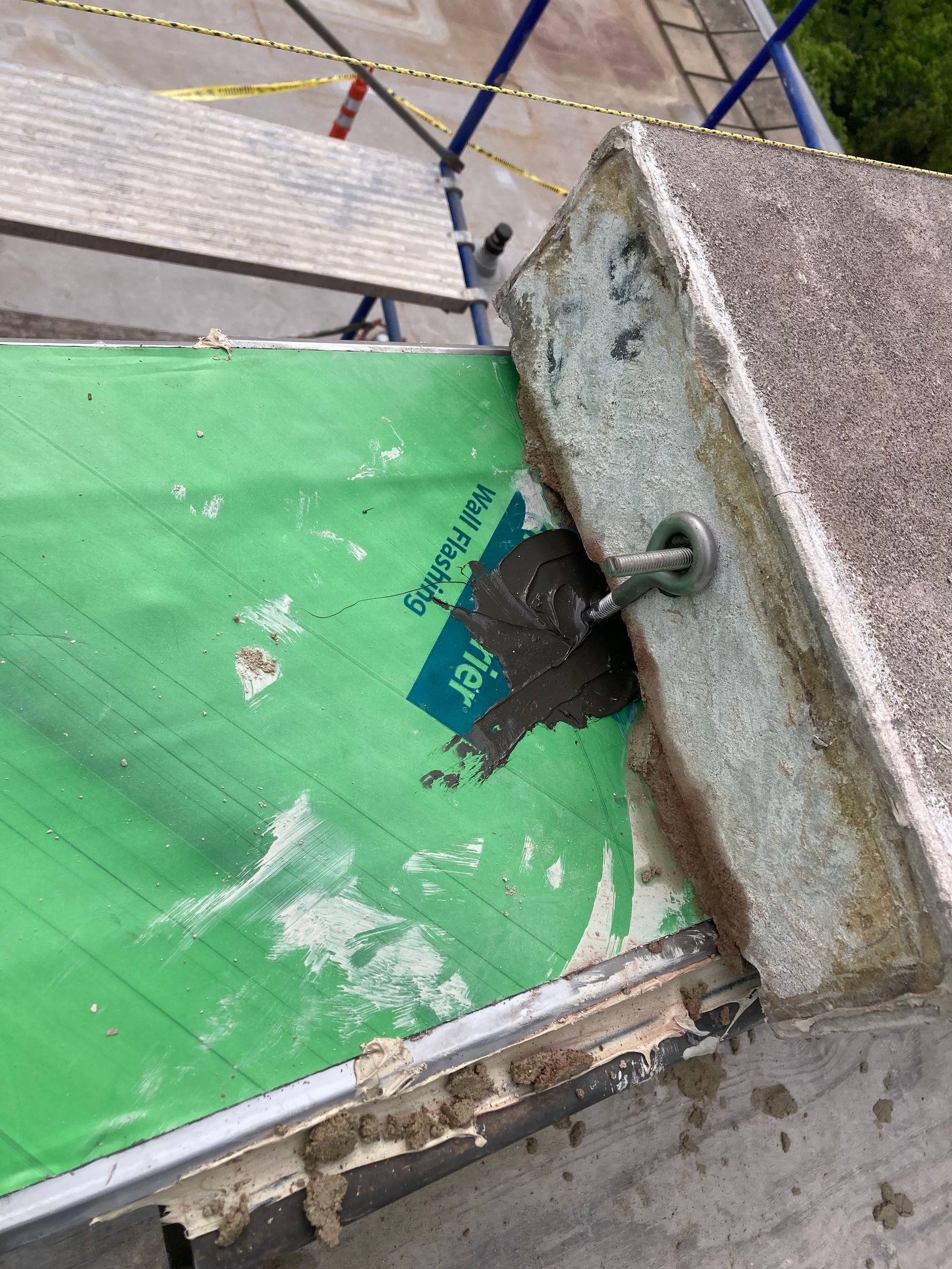 A piece of green water repellent on the roof of Evanston hospital