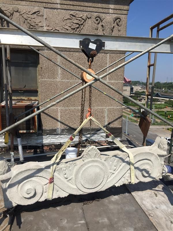 Gary City Hall's Parapet is lifted back into place after cleaning