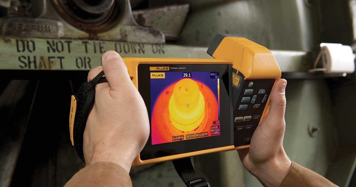 Infrared thermography scan detecting hidden moisture and masonry issues during building inspection to prevent costly winter damage.