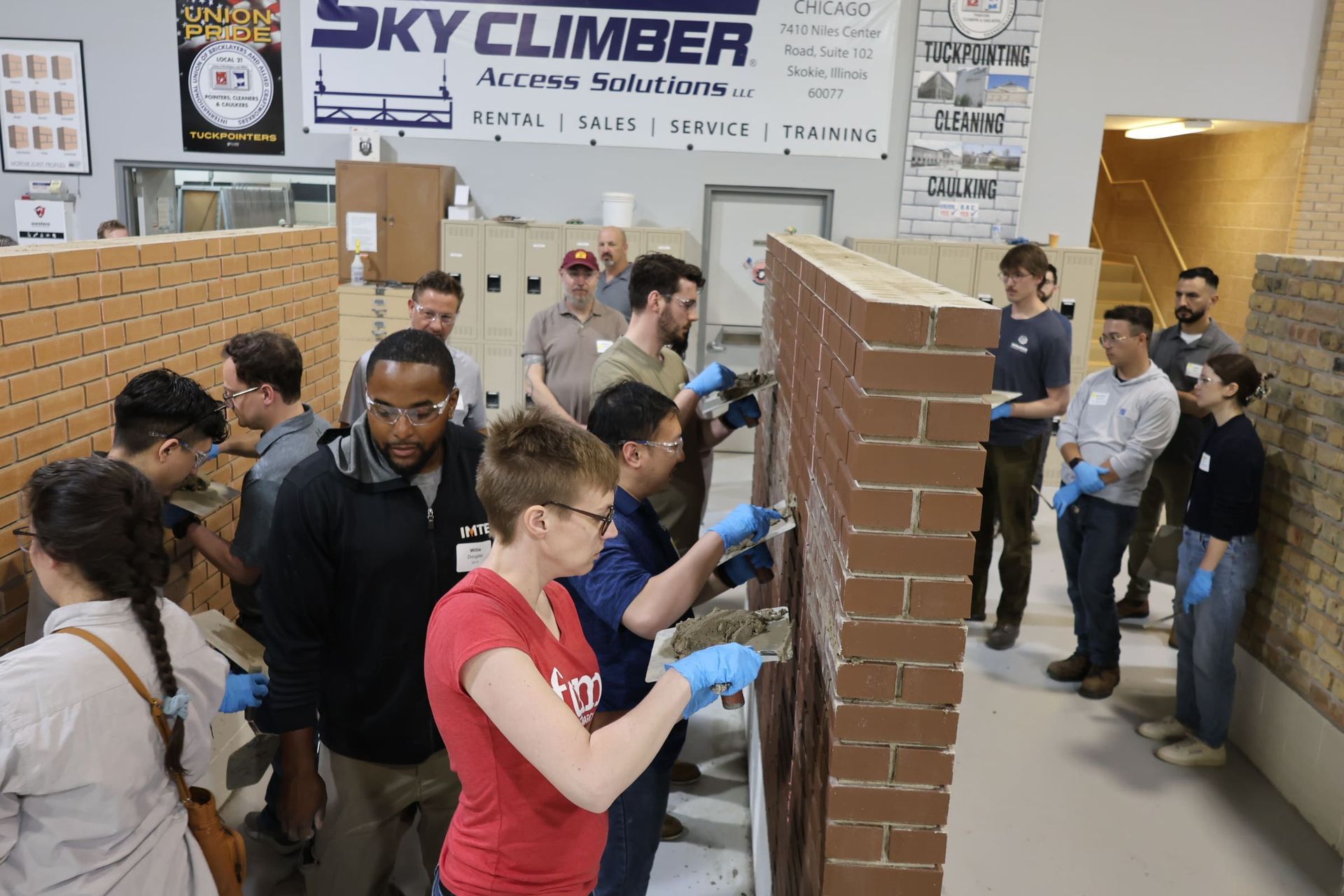 People demonstrating mortar extraction at the International Masonry Institute's facility.
