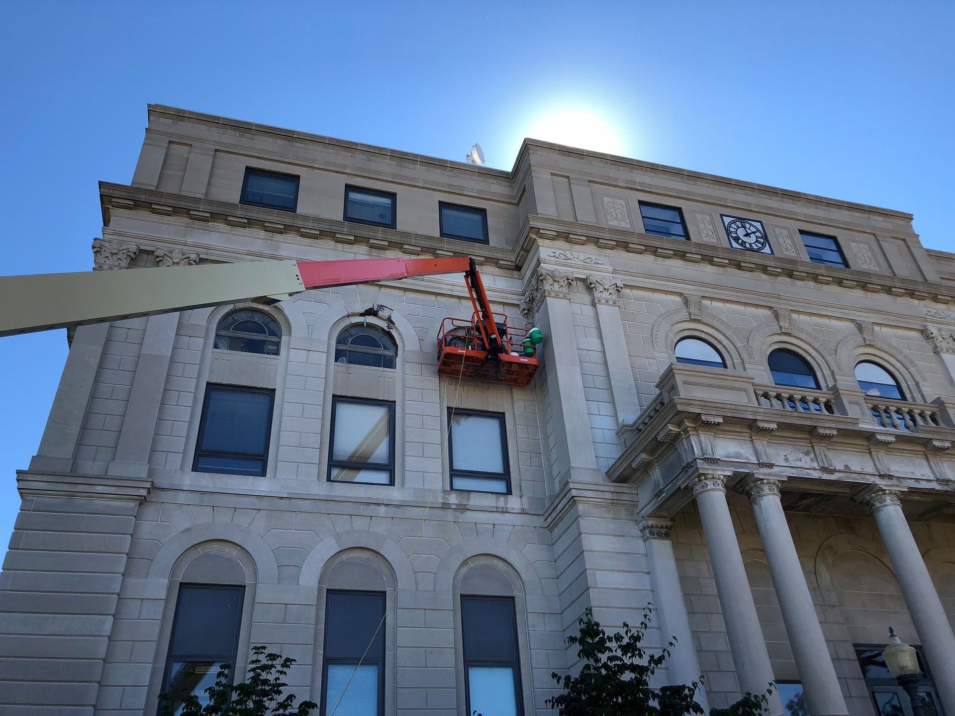 A large building with a crane on top of it
