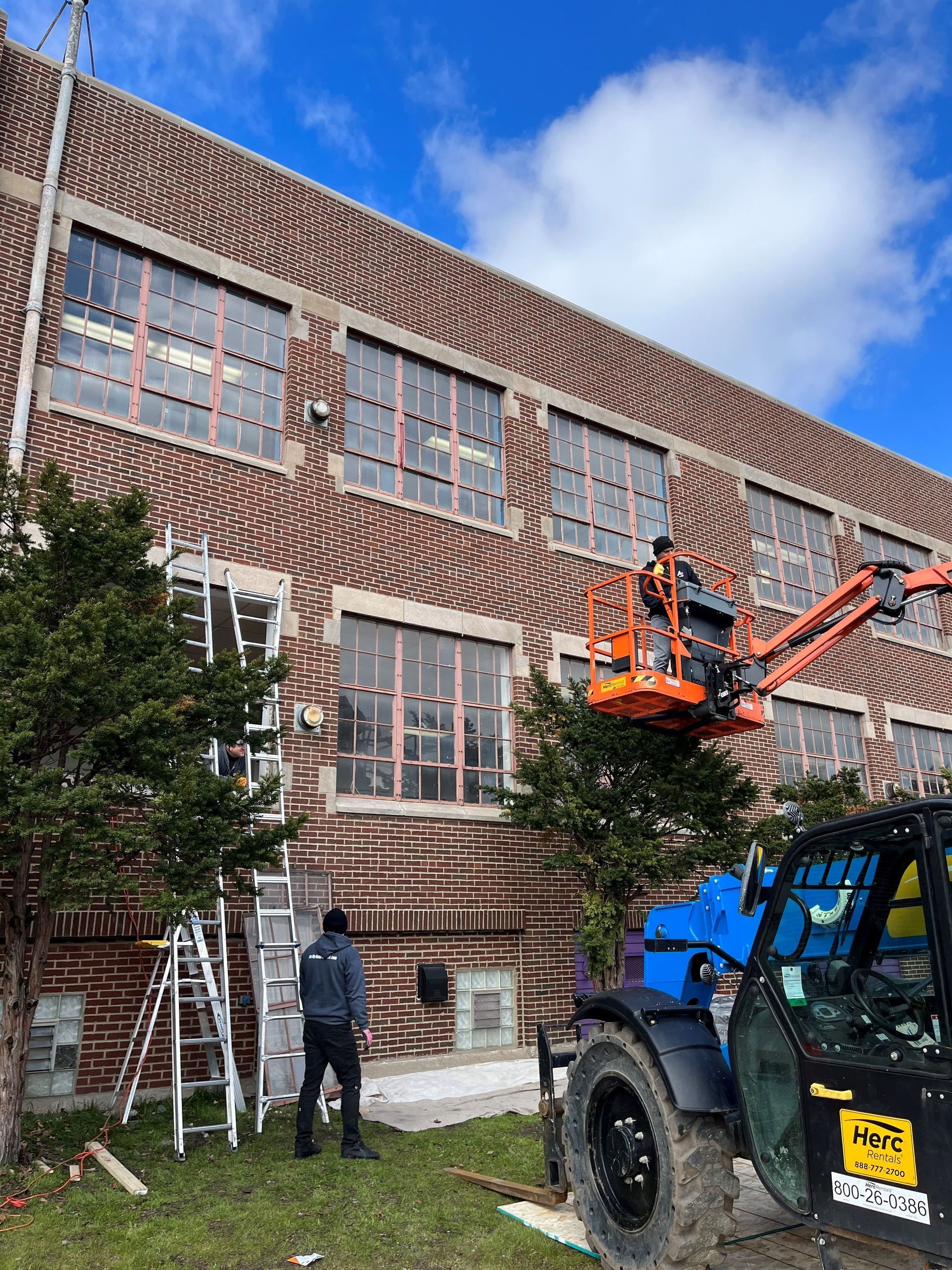 RestoreWorks crew performing spring break masonry restoration at St. Casimir School in Hammond, Indiana. Minimizing disruption while addressing facade maintenance for an educational building.