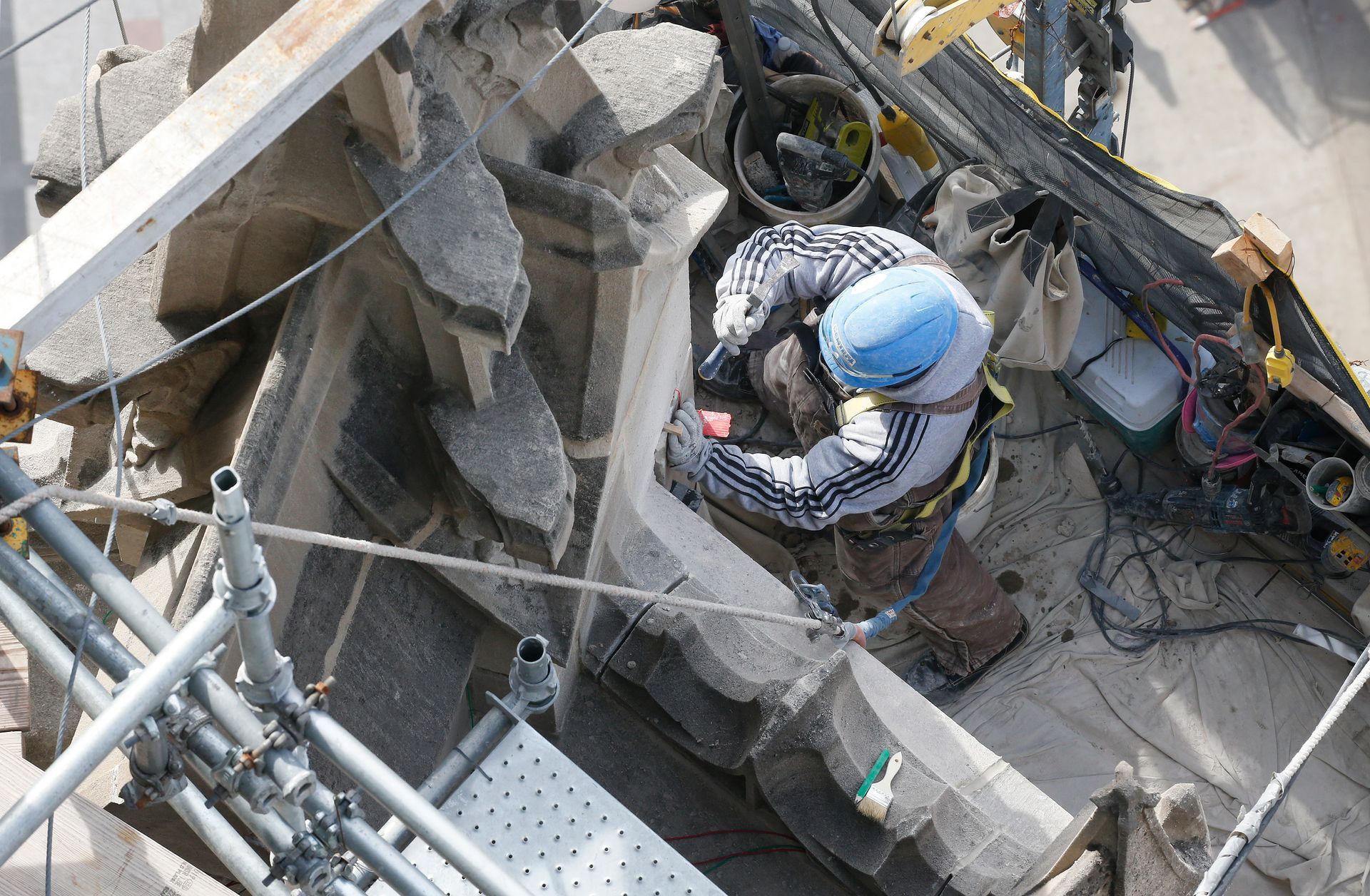 An aerial view of a construction worker working on Tribune Tower