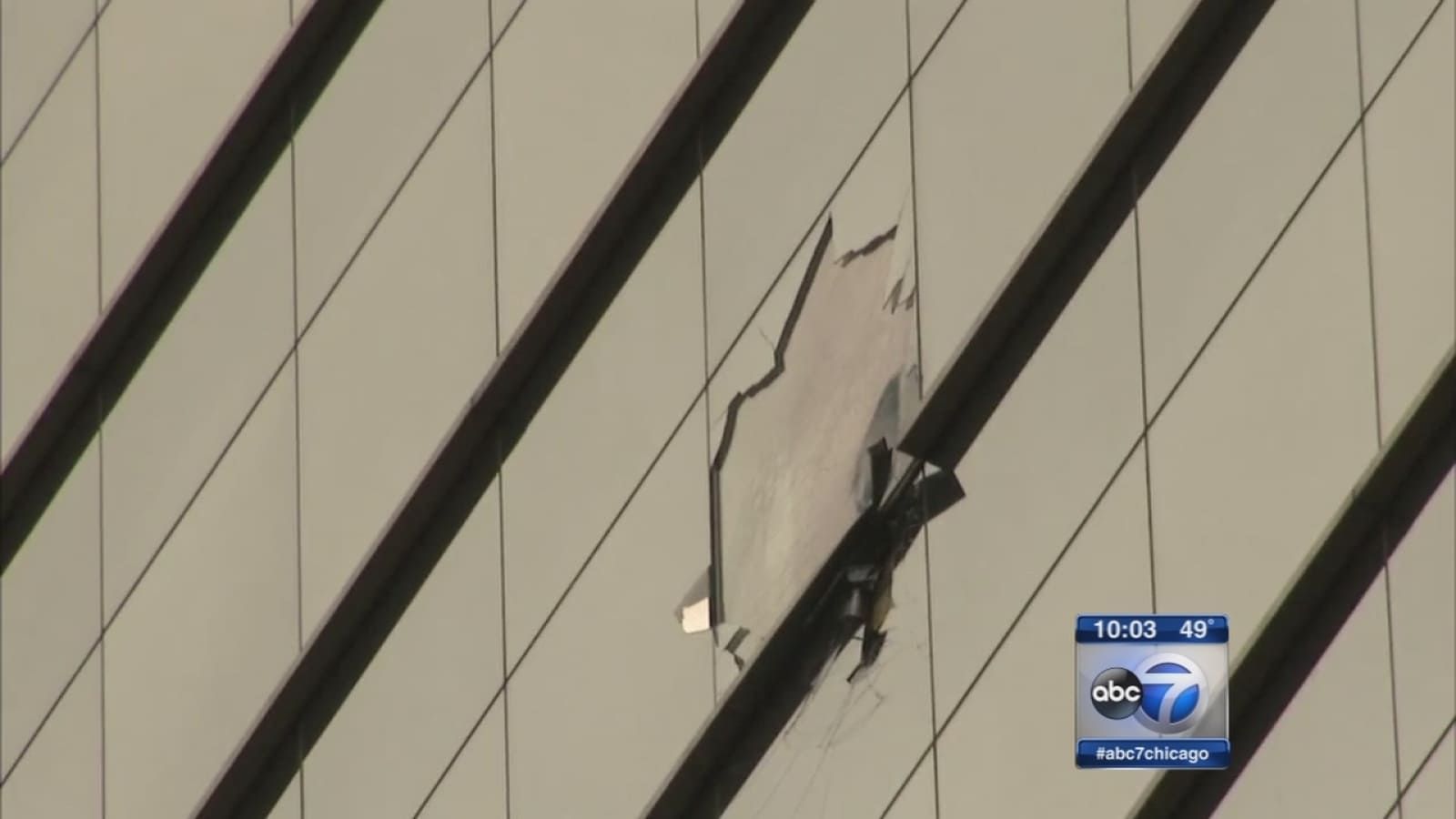 Wind damage to glass curtain wall on a Chicago high-rise building in 2016, showing shattered panel and structural impact during severe weather event. Image source: ABC7 Chicago.