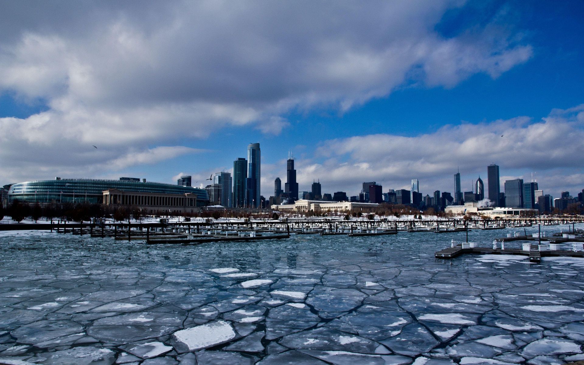 Winter view of downtown Chicago with ice covering Lake Michigan.