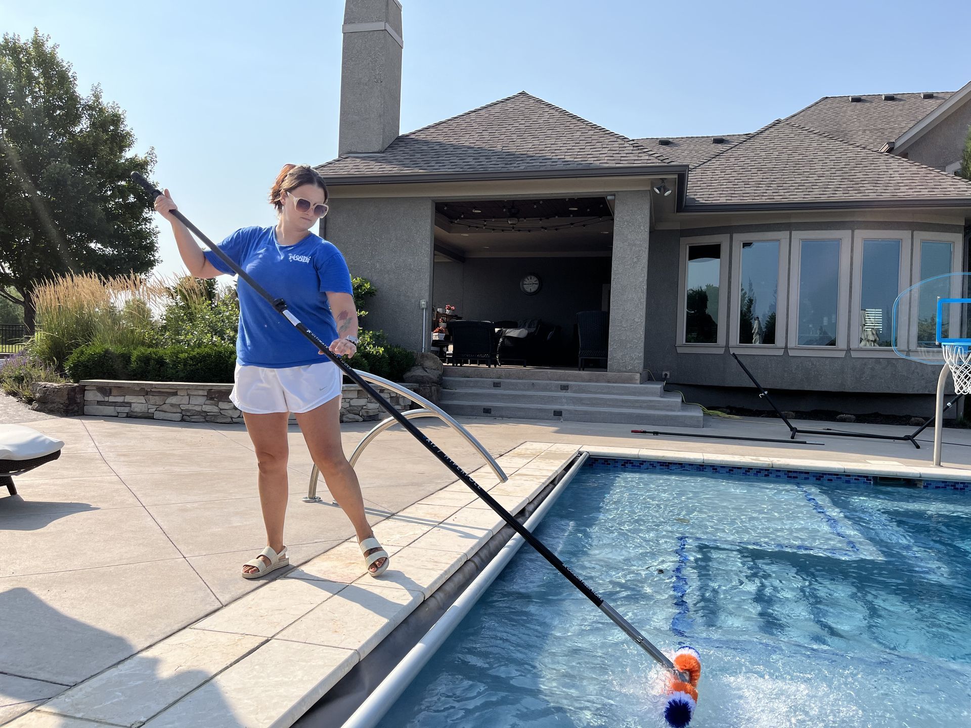 Our service tech is brushing the pool