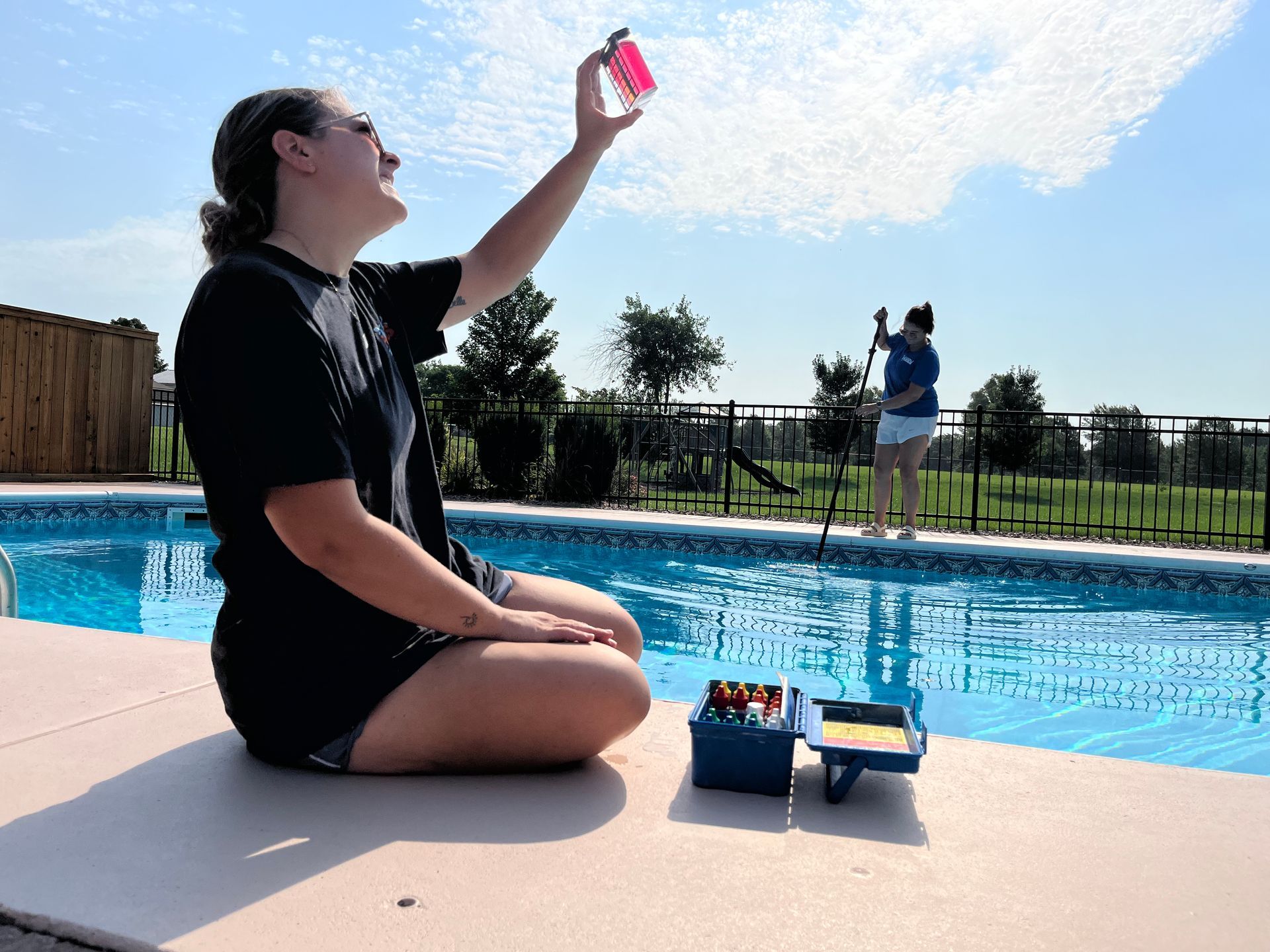 Our Service Techs are checking chemicals and brushing the pool