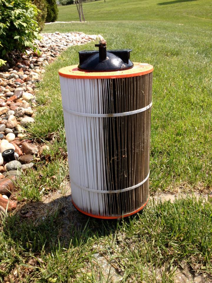 This shows a cartridge filter halfway through the cleaning process