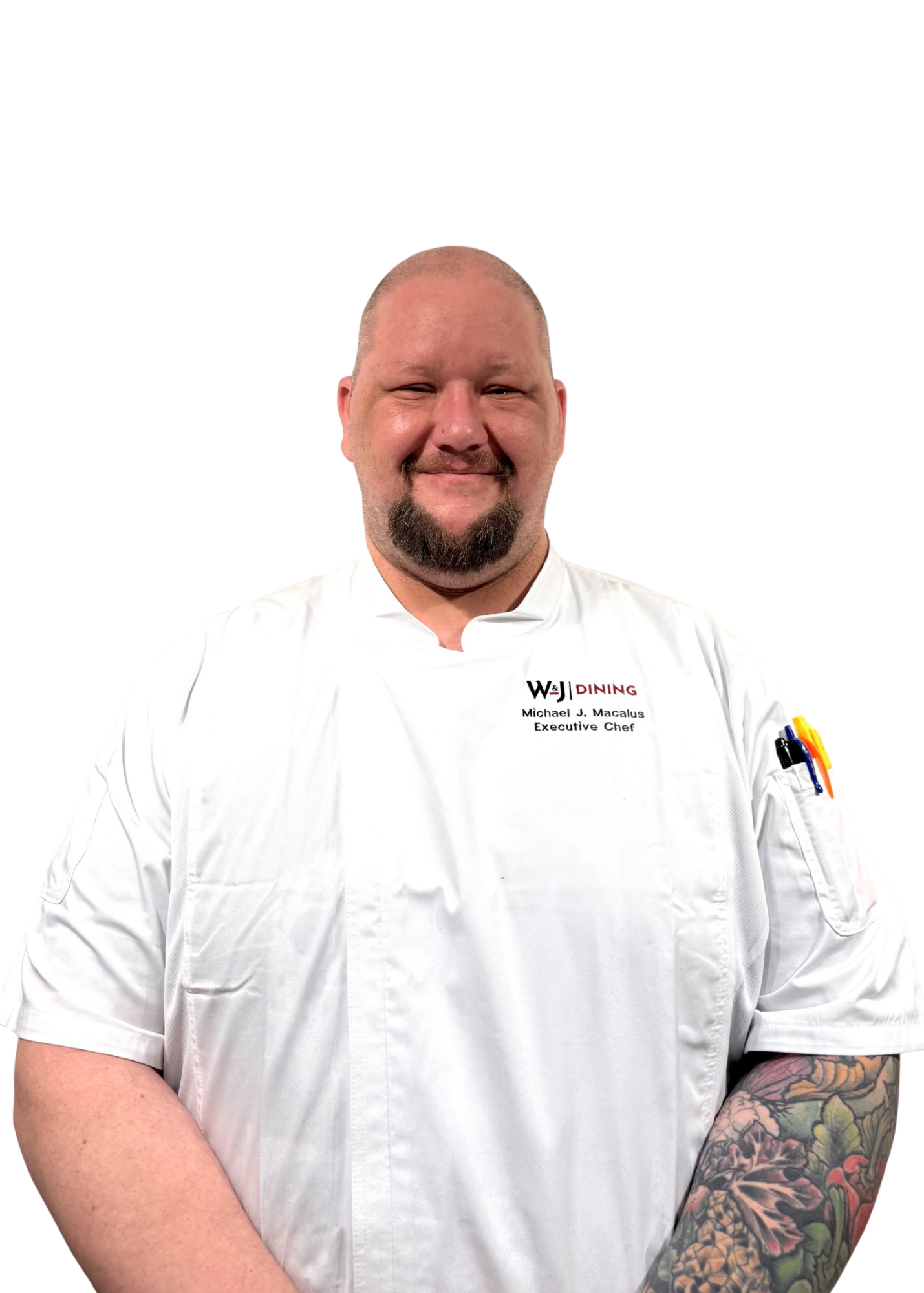 Chef in white uniform and dark brown beard.