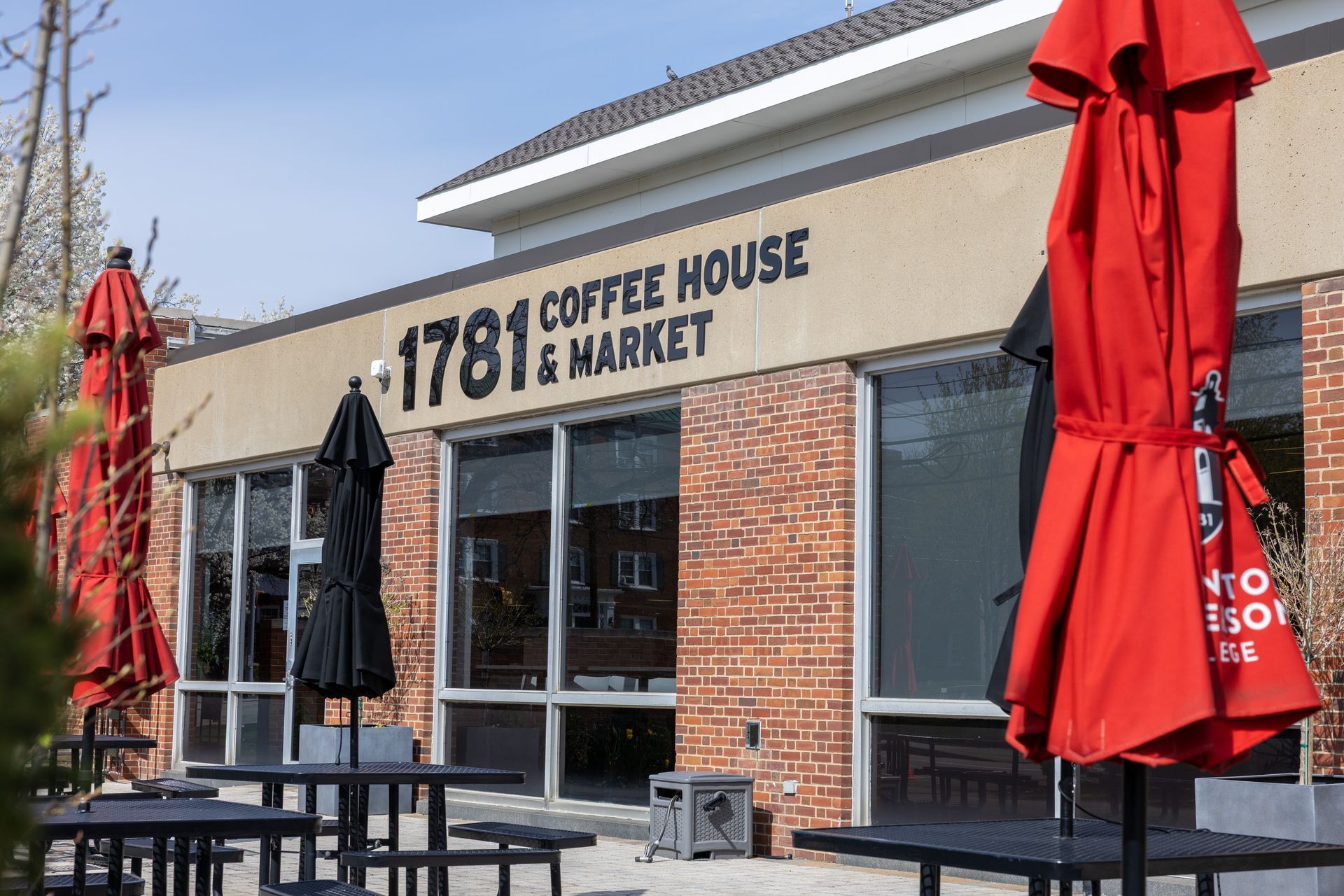 A man in a chef 's hat is posing for a picture with two other chefs