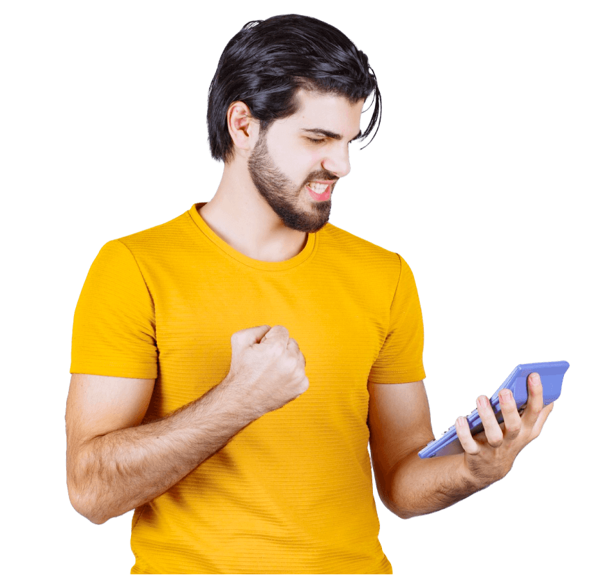 A man in a yellow shirt is holding a cell phone in his hand.