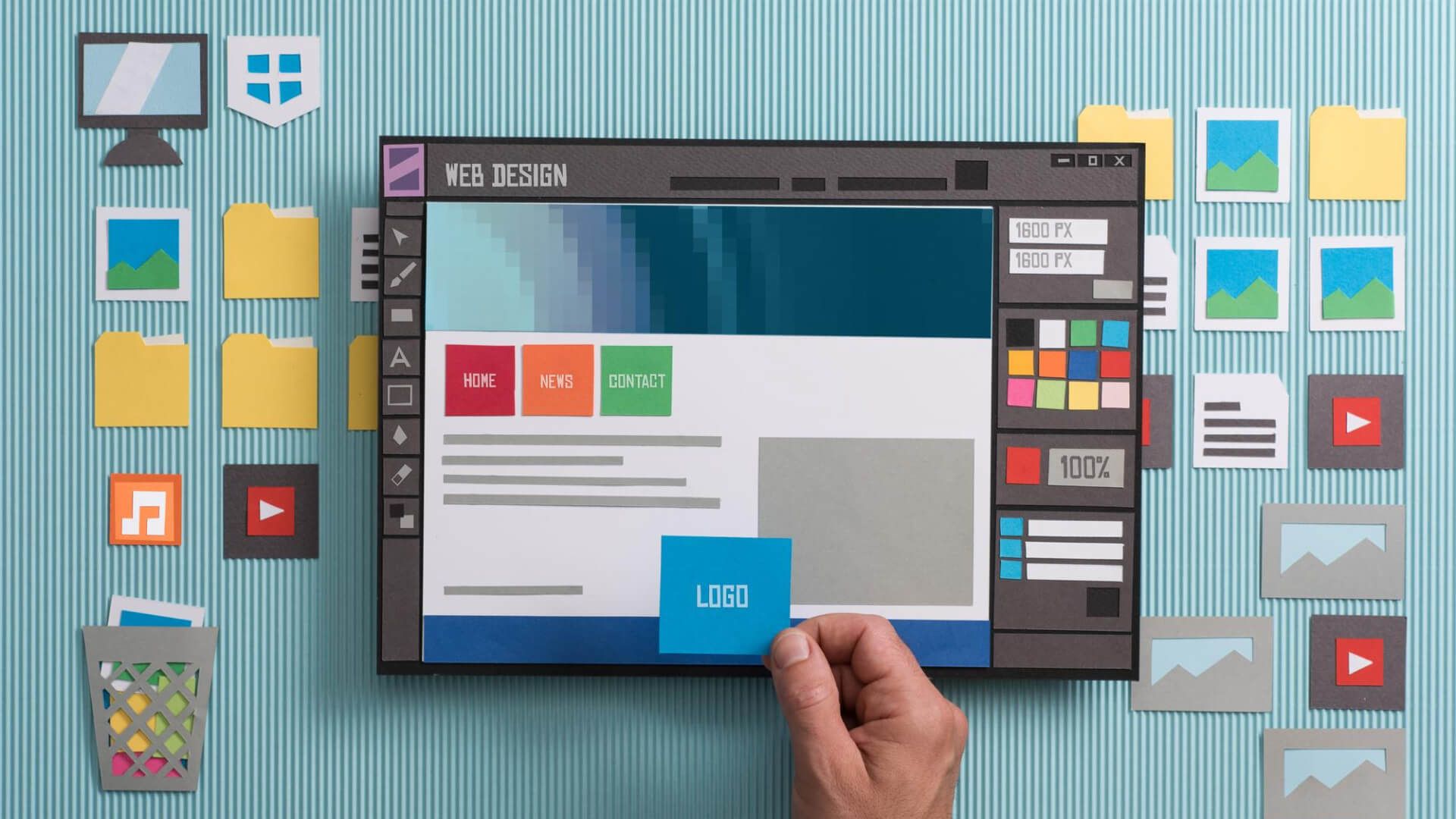 A person is holding a piece of paper in front of a computer screen.