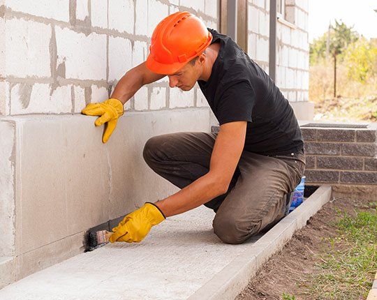 Foundation Waterproofing — Construction Man Working on the Wall in Petaluma, CA