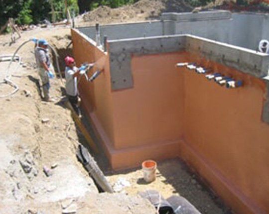 House Waterproofing  — Workers Fixing the House Wall in Petaluma, CA