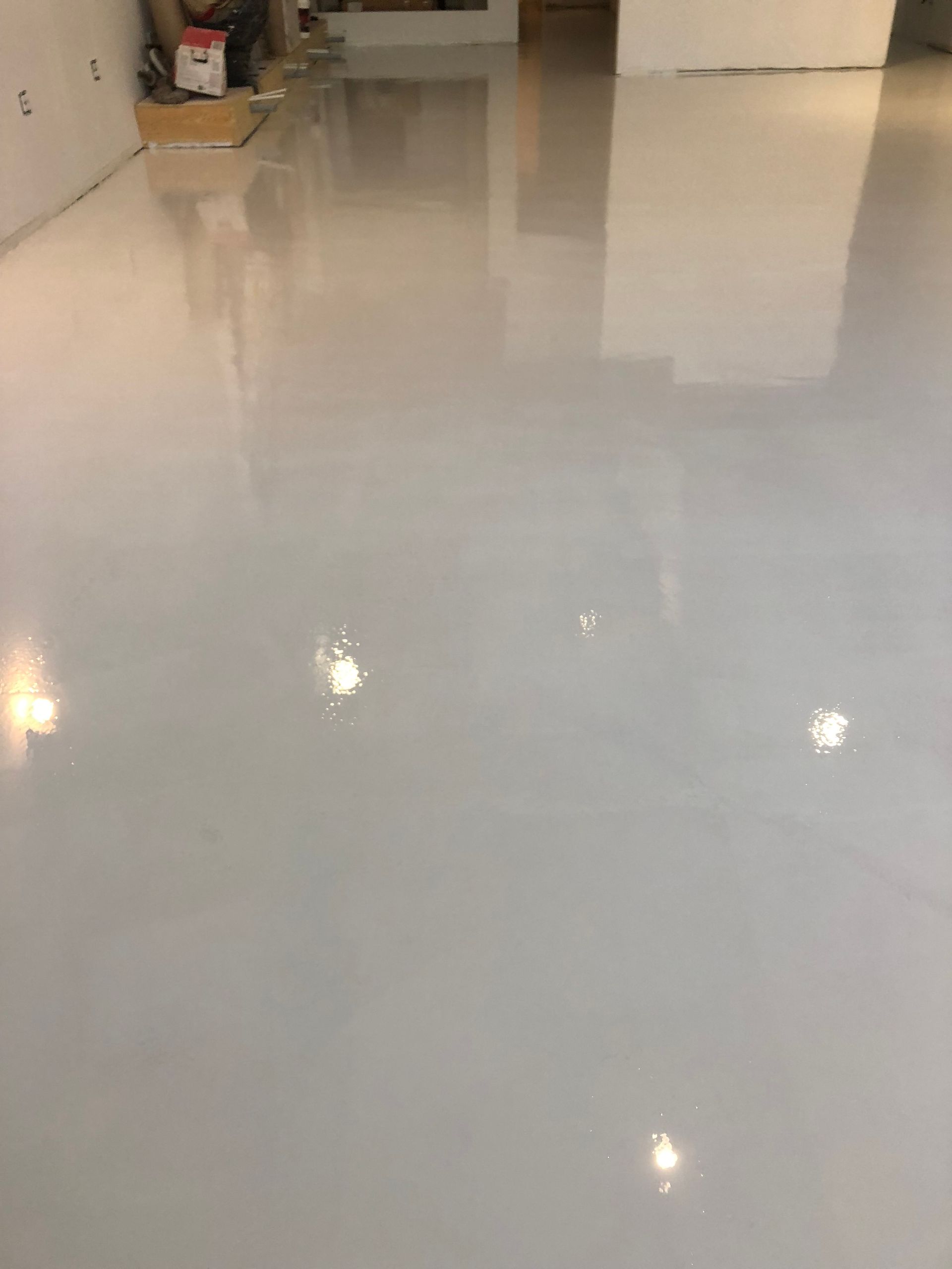 A white floor with a lot of lights on it.