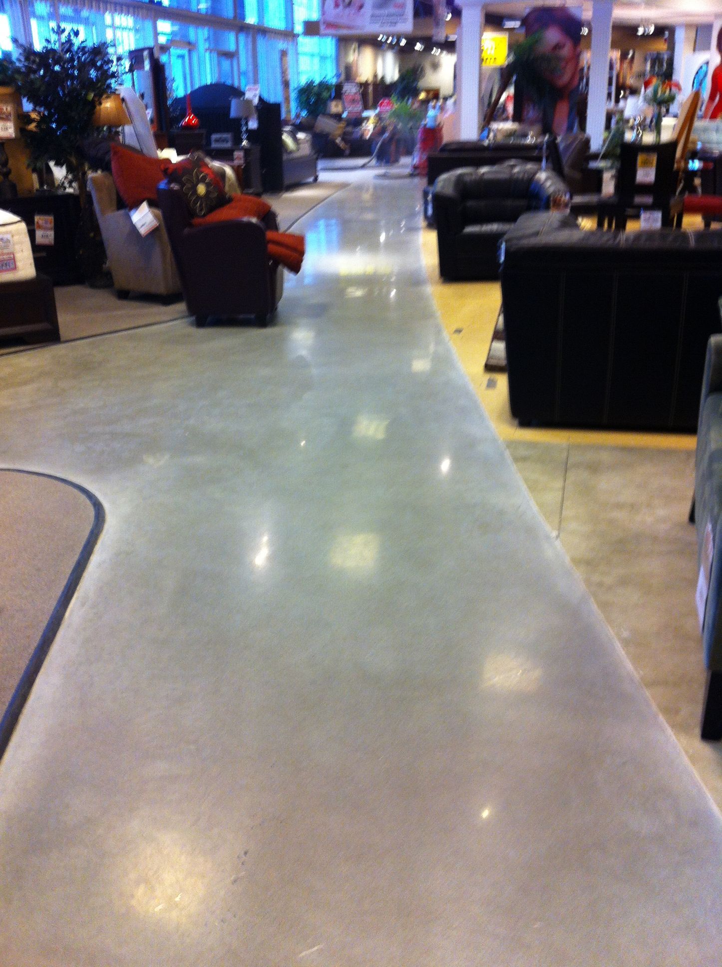 A room with a lot of furniture and a sign that says pay here