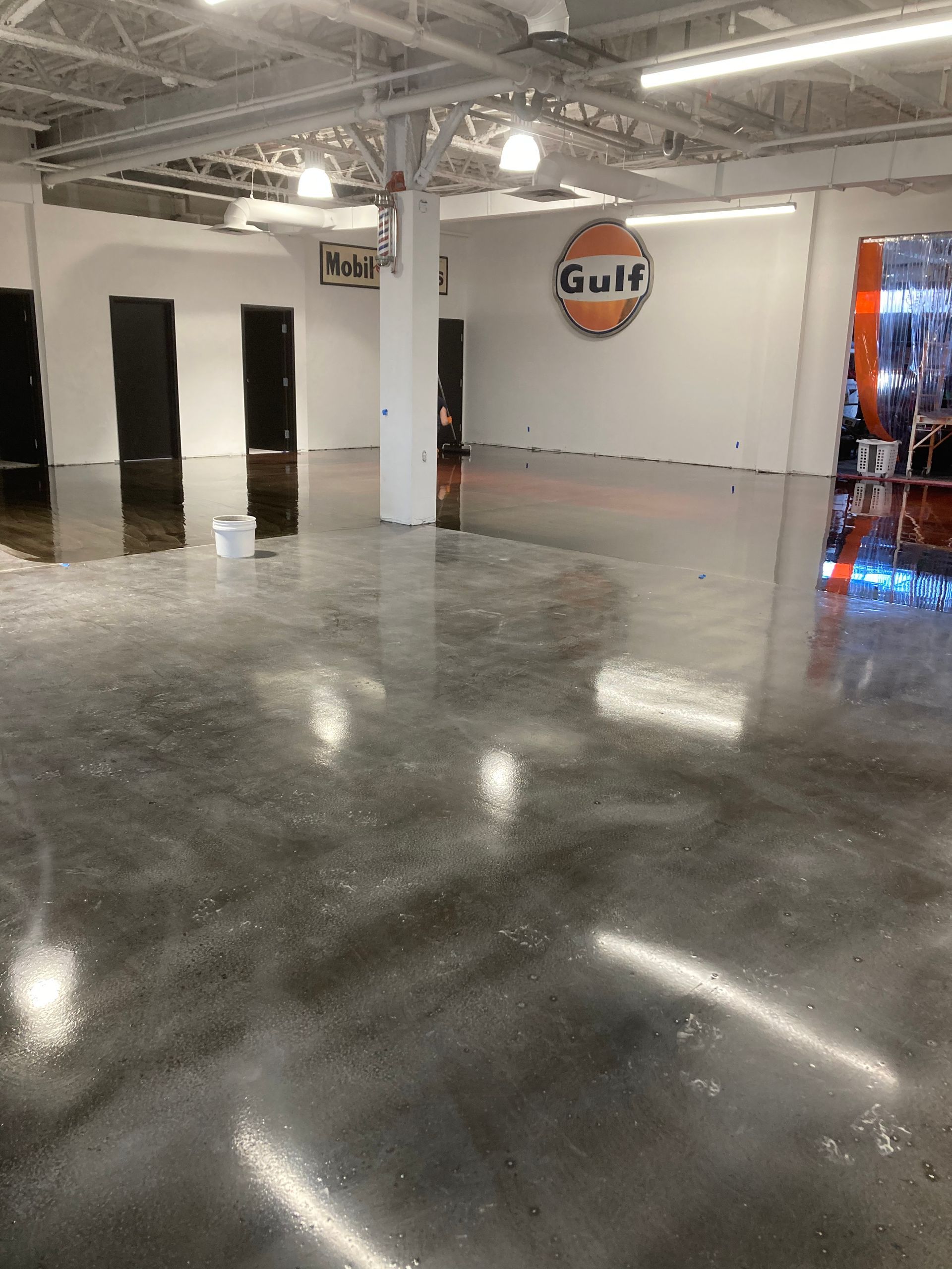 A large room with a gulf logo on the wall