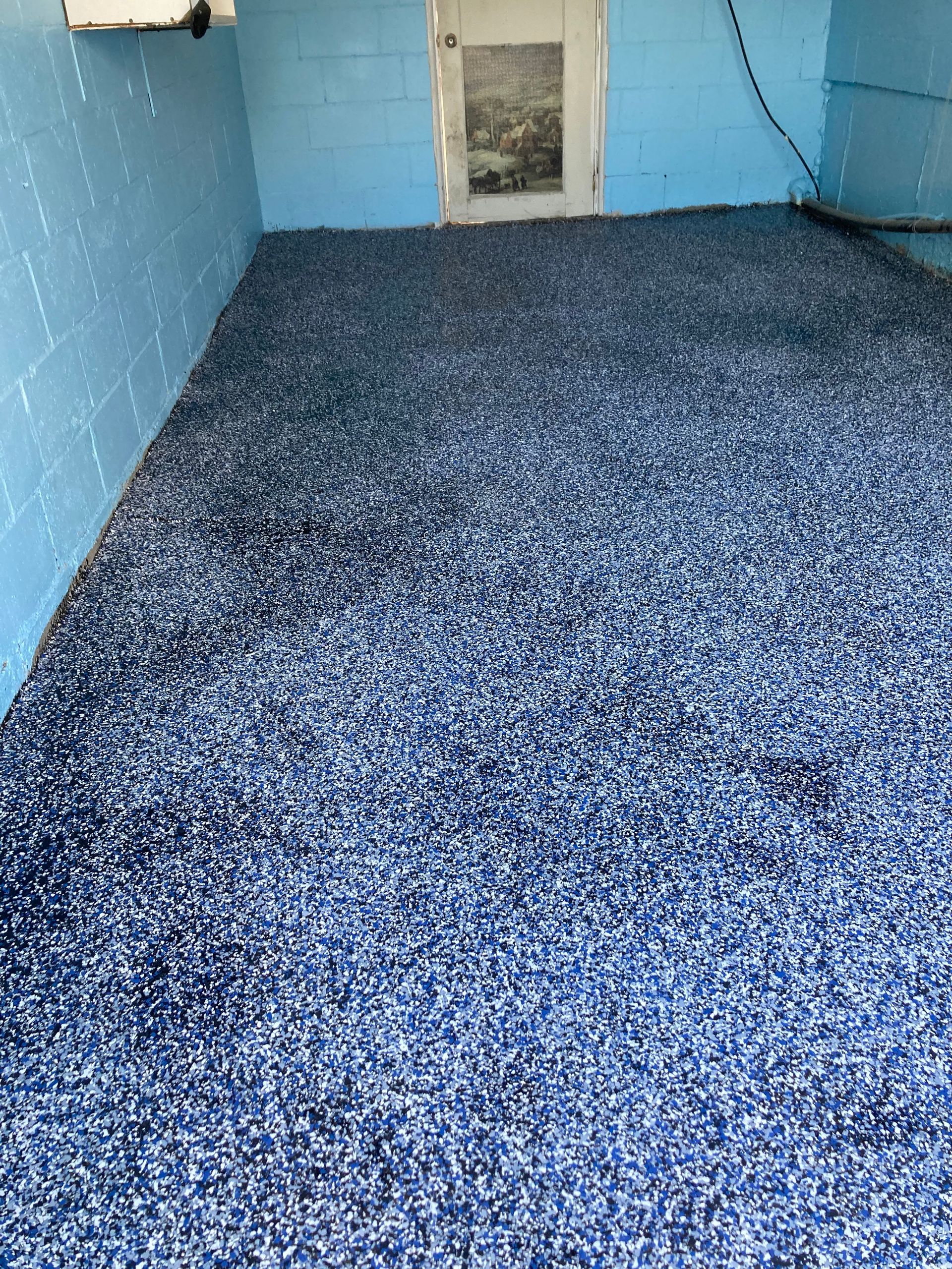 A room with a blue floor and blue walls.
