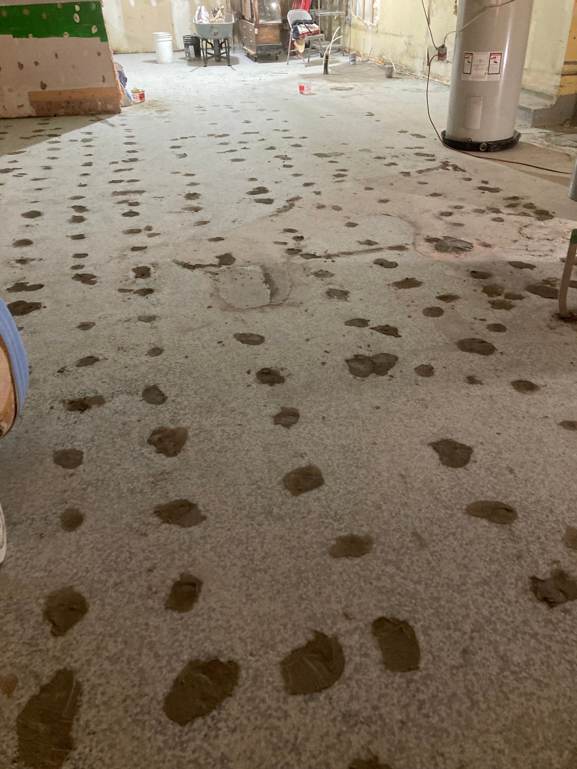 A large room with a lot of footprints on the floor