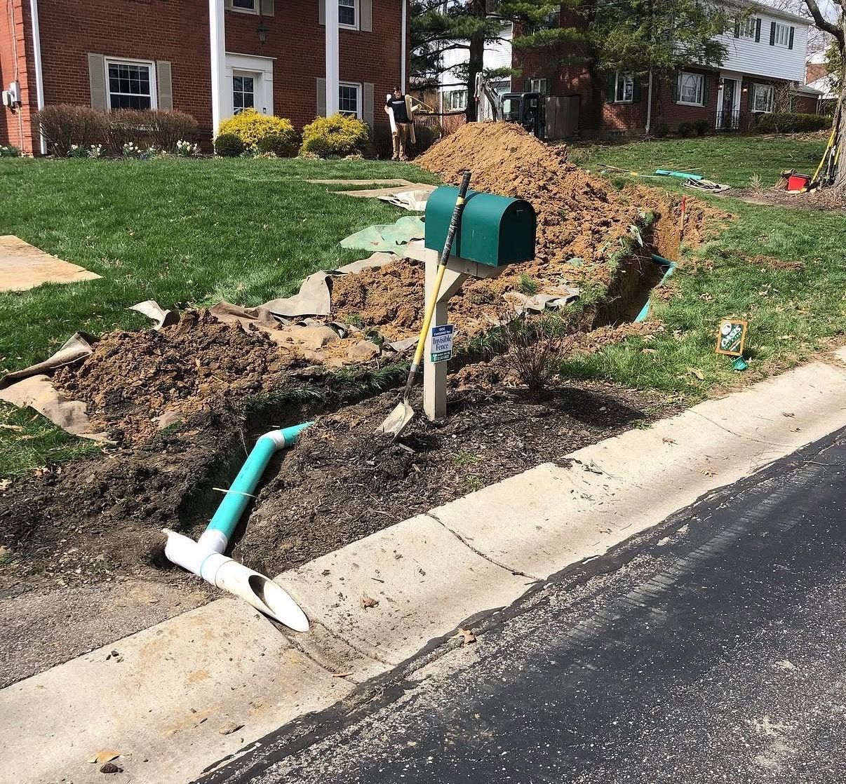 Drainage being run in front yard to prevent water from pooling