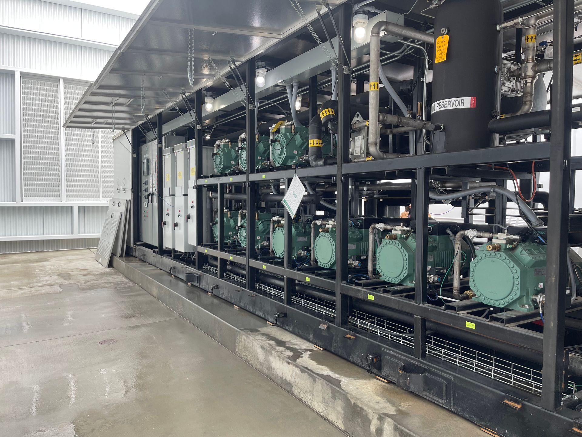 A large warehouse with a lot of machinery inside of it.