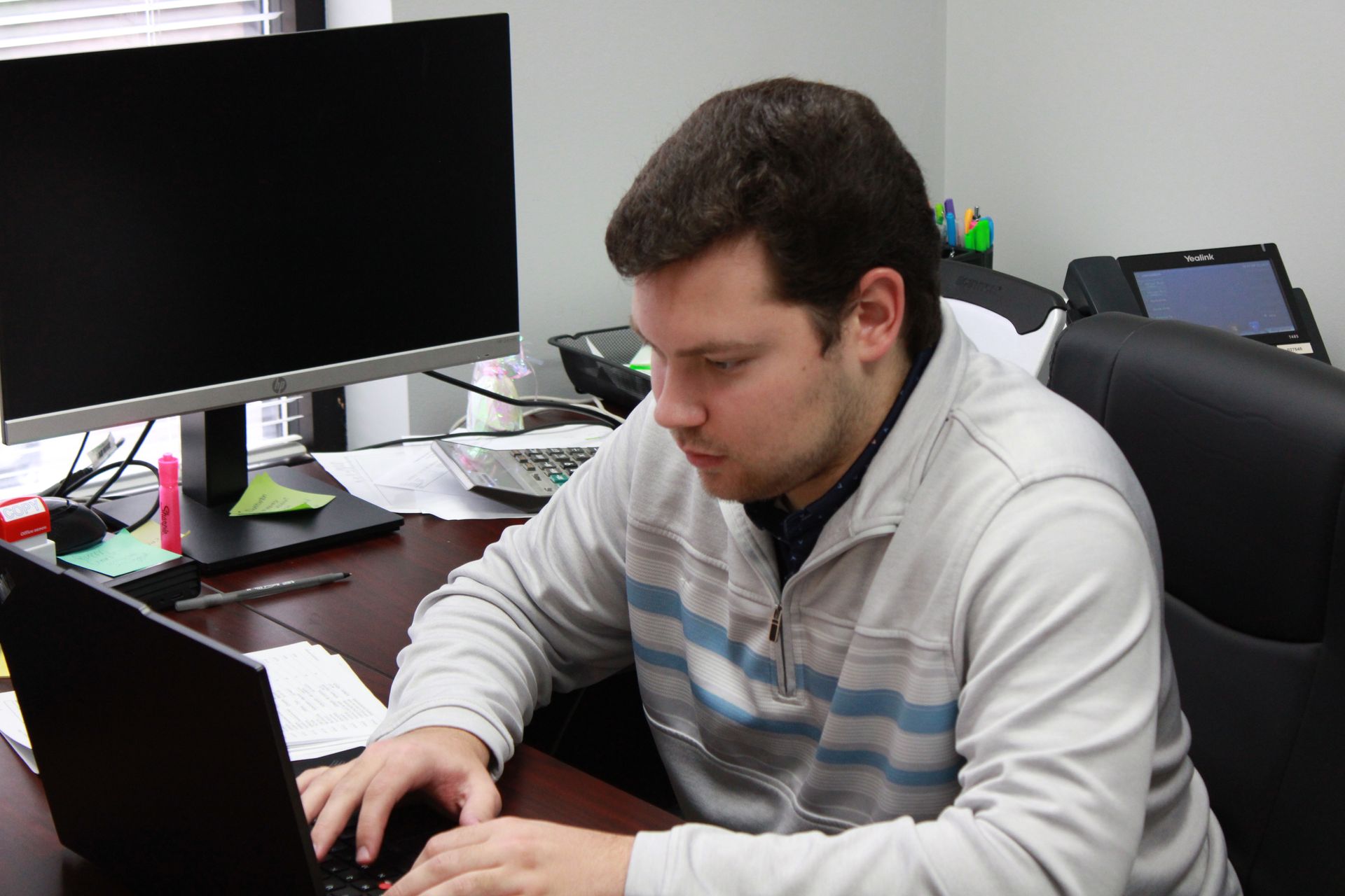 Harrison Burg, Senior Financial Analyst - Ext. 205 at The Tennie Group LLC — staff portrait showing focus on tax and accounting services for business development.