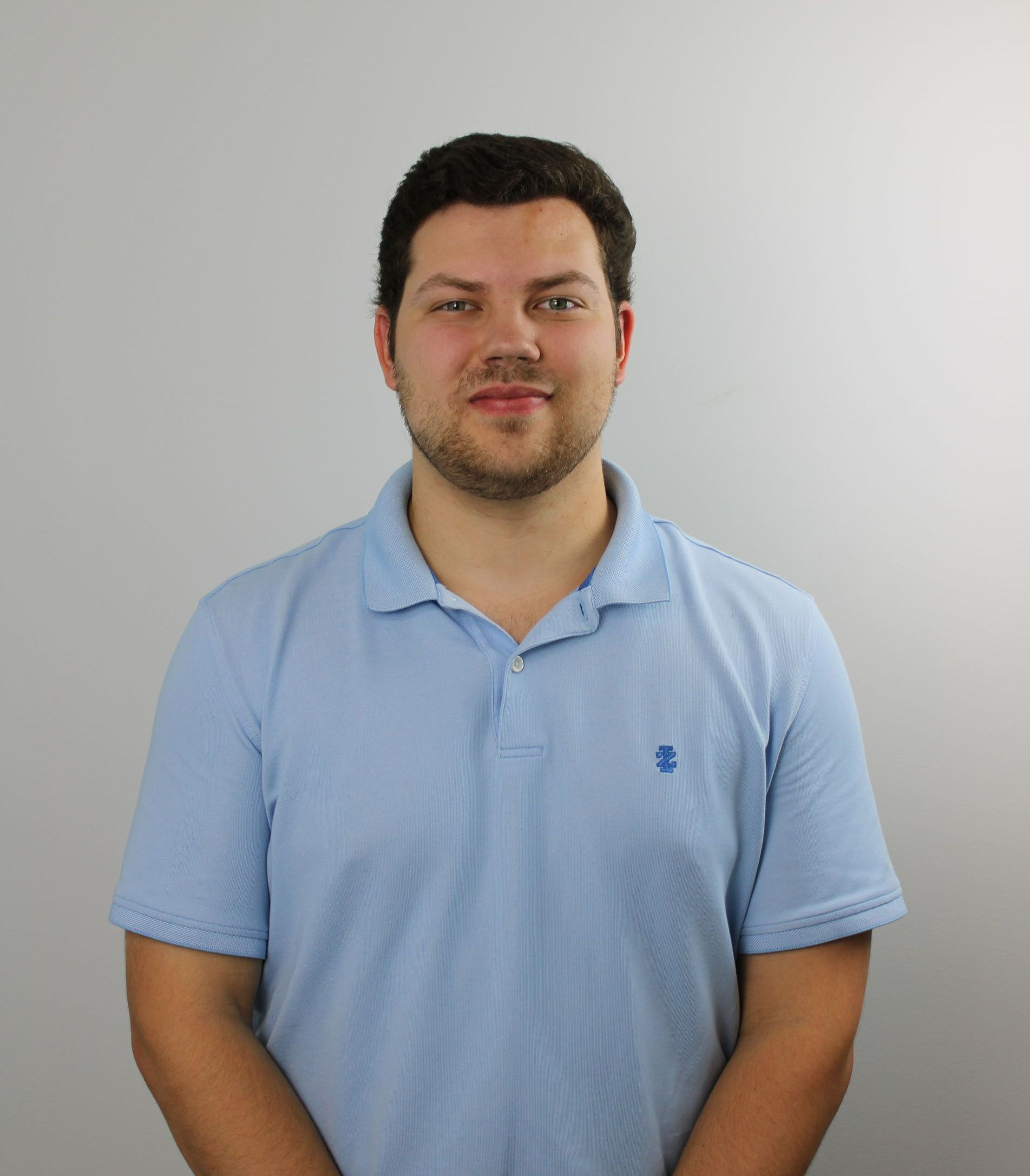 Harrison Burg, Senior Financial Analyst - Ext. 205 at The Tennie Group LLC — Professional portrait for staff directory showcasing our leadership in tax, accounting, and business development services.