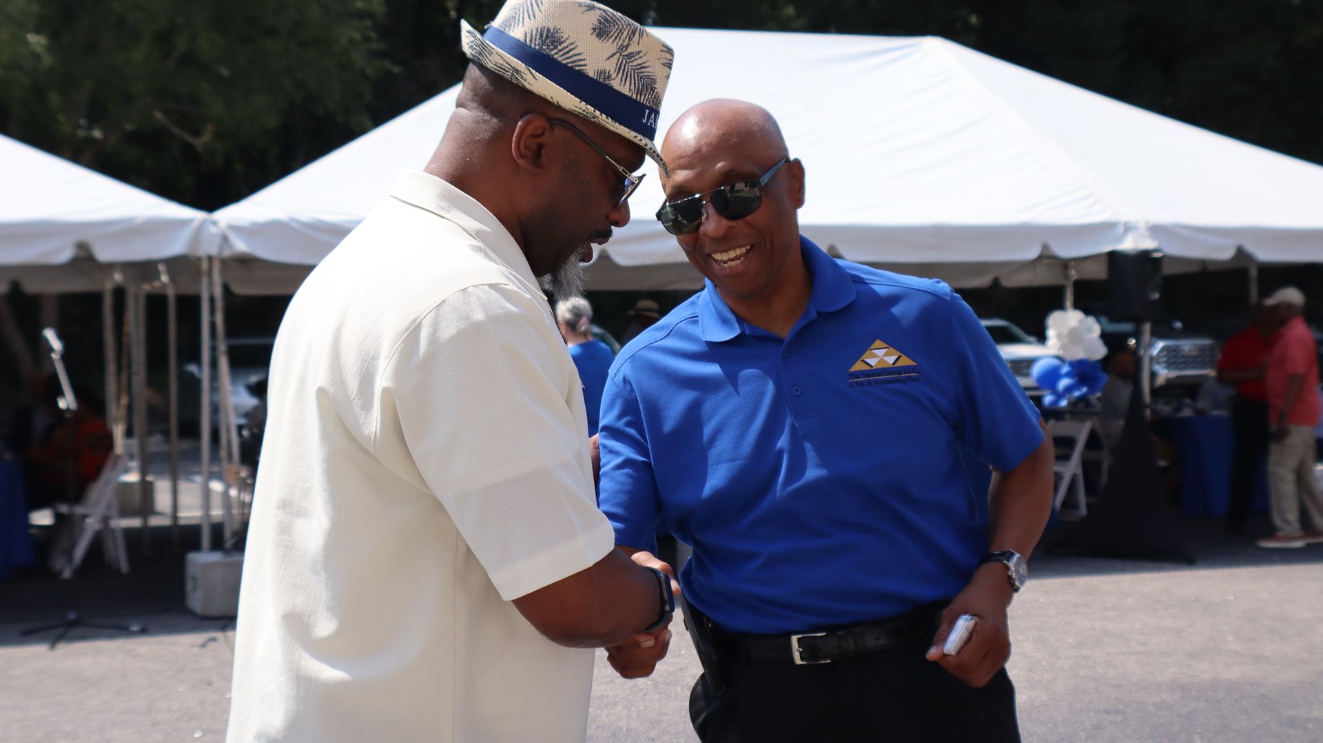  Darrell Tennie, CEO of The Tennie Group LLC, shaking hands with a supporter at the Campaign Kickoff for North Carolina Representative, James Roberson, hosted by The Tennie Group at the main corporate office in Knightdale, North Carolina