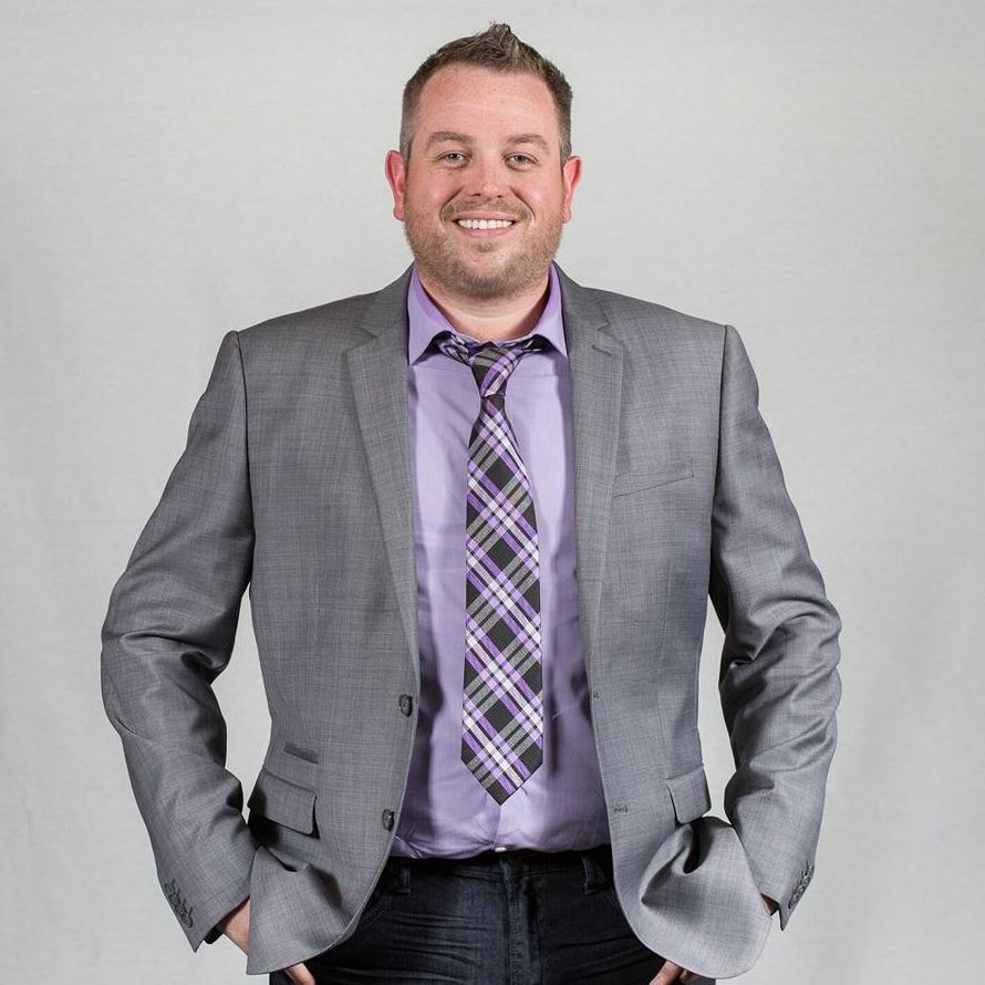 Dean Brown color image in suite jacket and tie