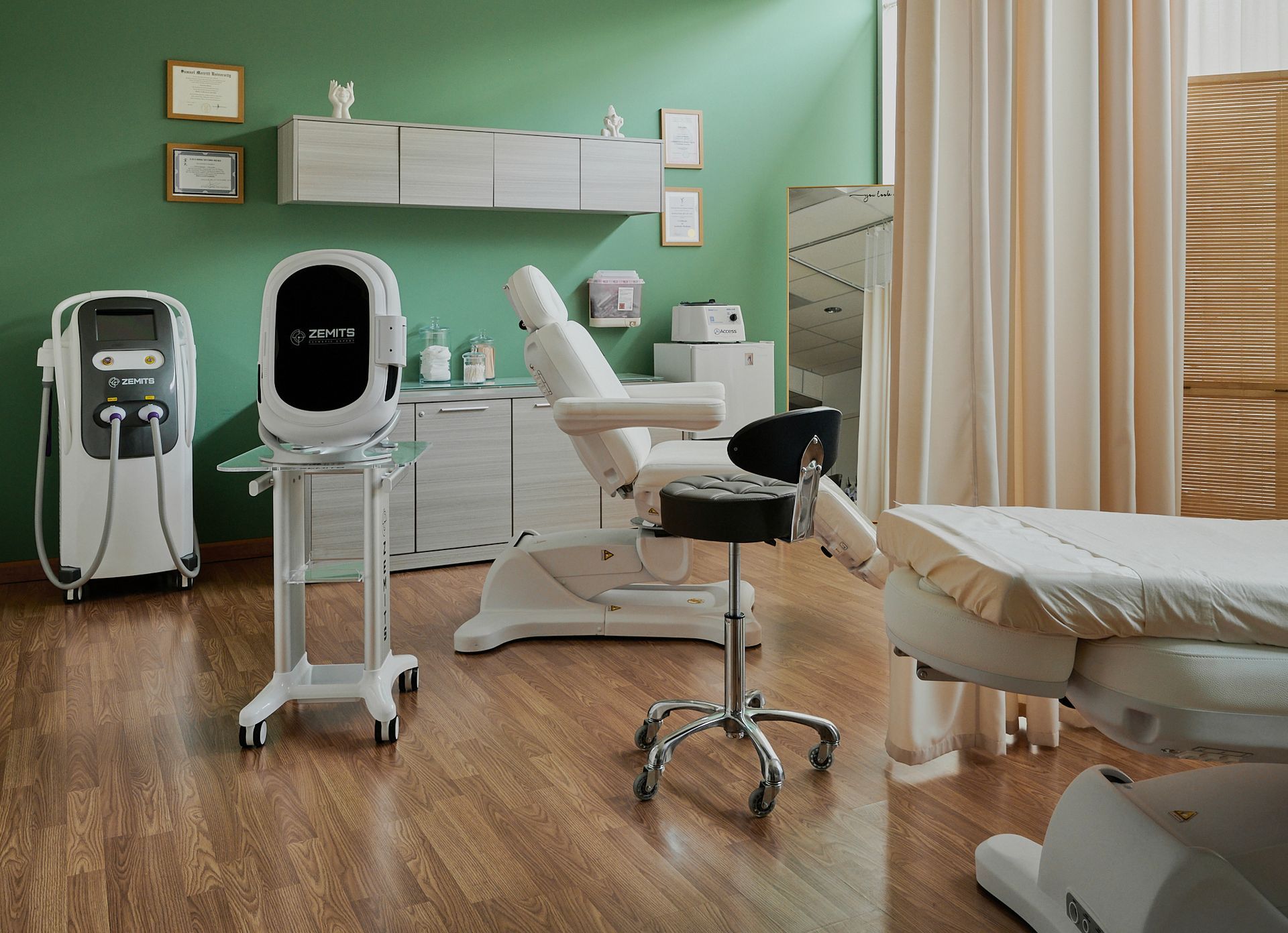 A room with a bed , chair , and machine in it.