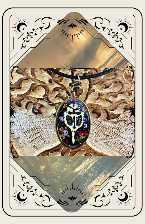 Oval pendant with a colorful design on black cord, set on a textured gold background, framed with decorative lines.