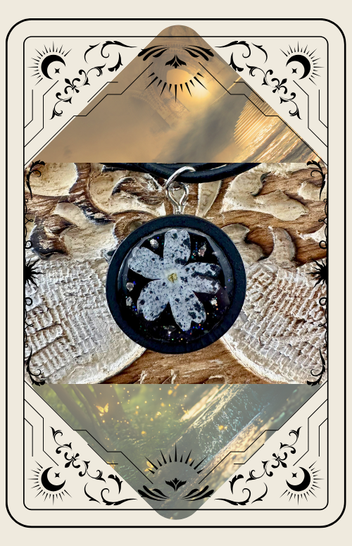Tarot card: a black, floral shape in the center, with a water stream above. Framed by a carved wood design.