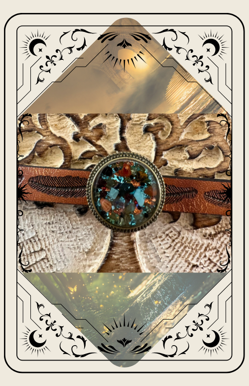 Decorative tarot card with ornate border and central image of a jeweled leather cuff bracelet.