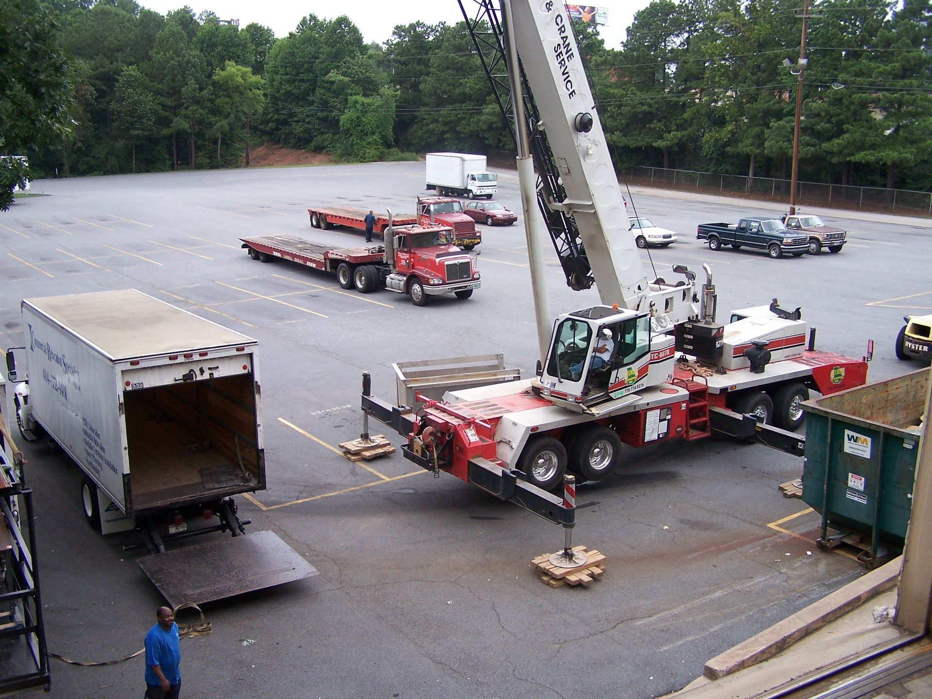 A room filled with lots of cardboard boxes and a chair.