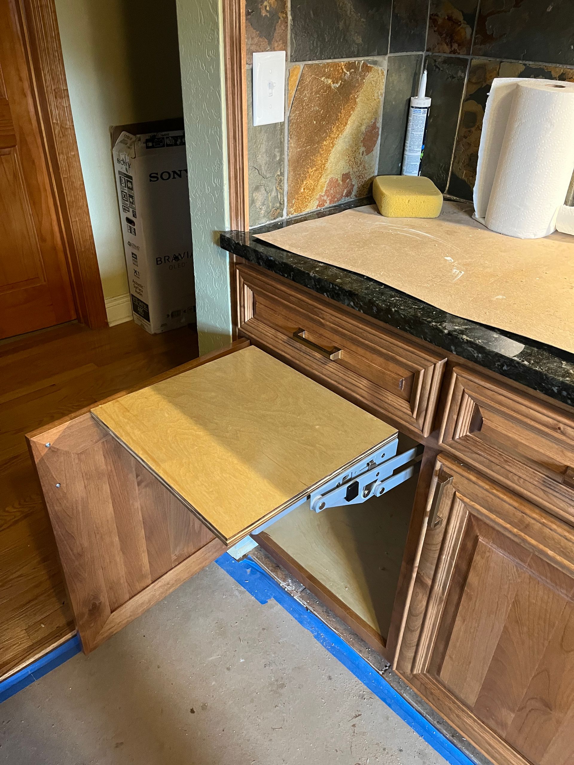 A bathroom vanity with a step built into it.