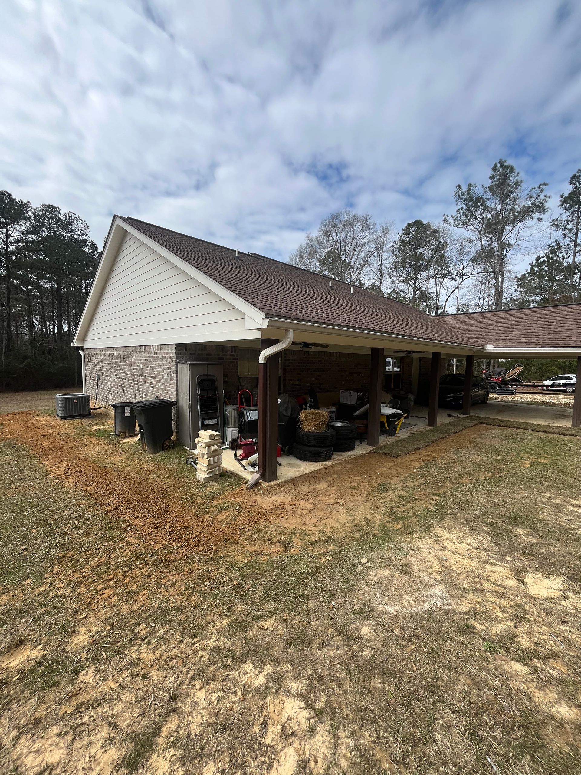A house with a covered patio in the backyard.