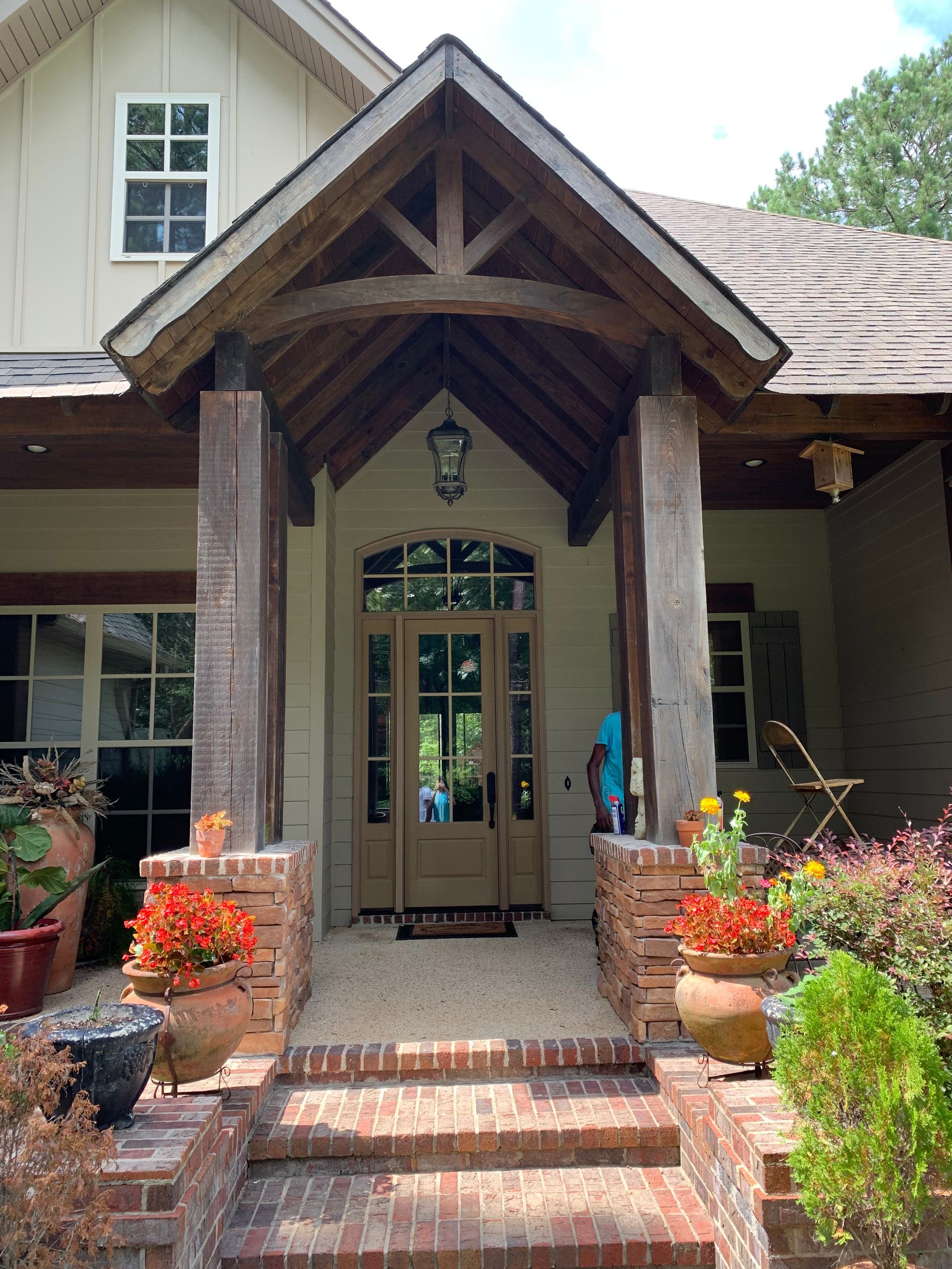 The front of a house with a porch and stairs