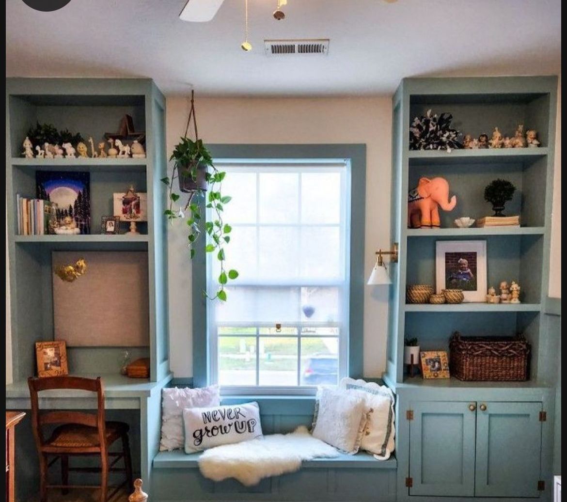 A window seat with a pillow that says 