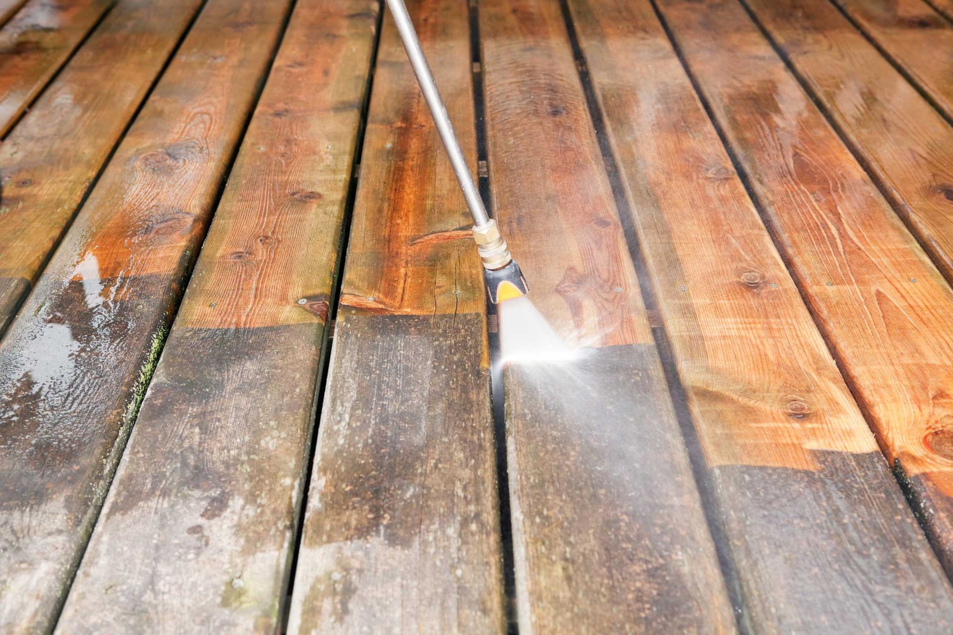 Pressure Washer Cleaning A Weathered Deck — Mt. Holly, NJ — Gcapital Handyman Services LLC