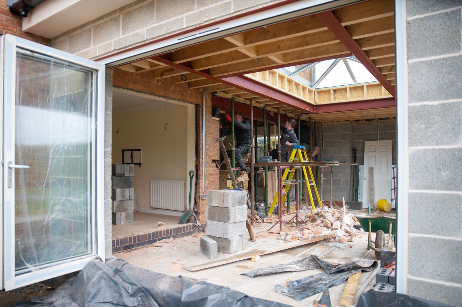 A house is being remodeled with a sliding glass door.