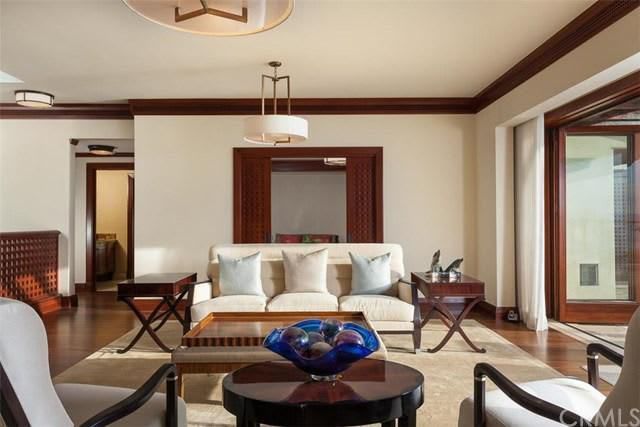 A living room with a couch a table and chairs