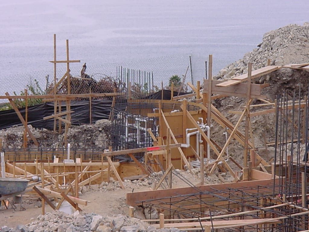 A construction site with a lot of wooden scaffolding.