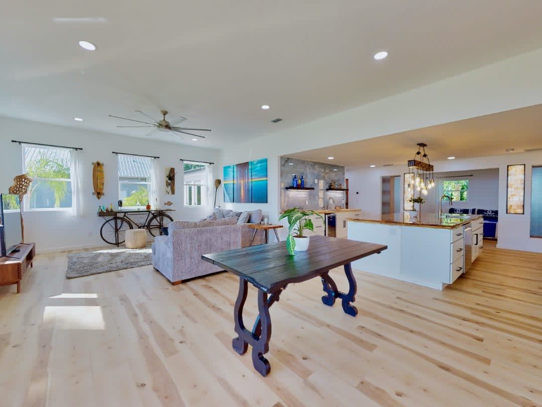 There is a table in the middle of the living room.