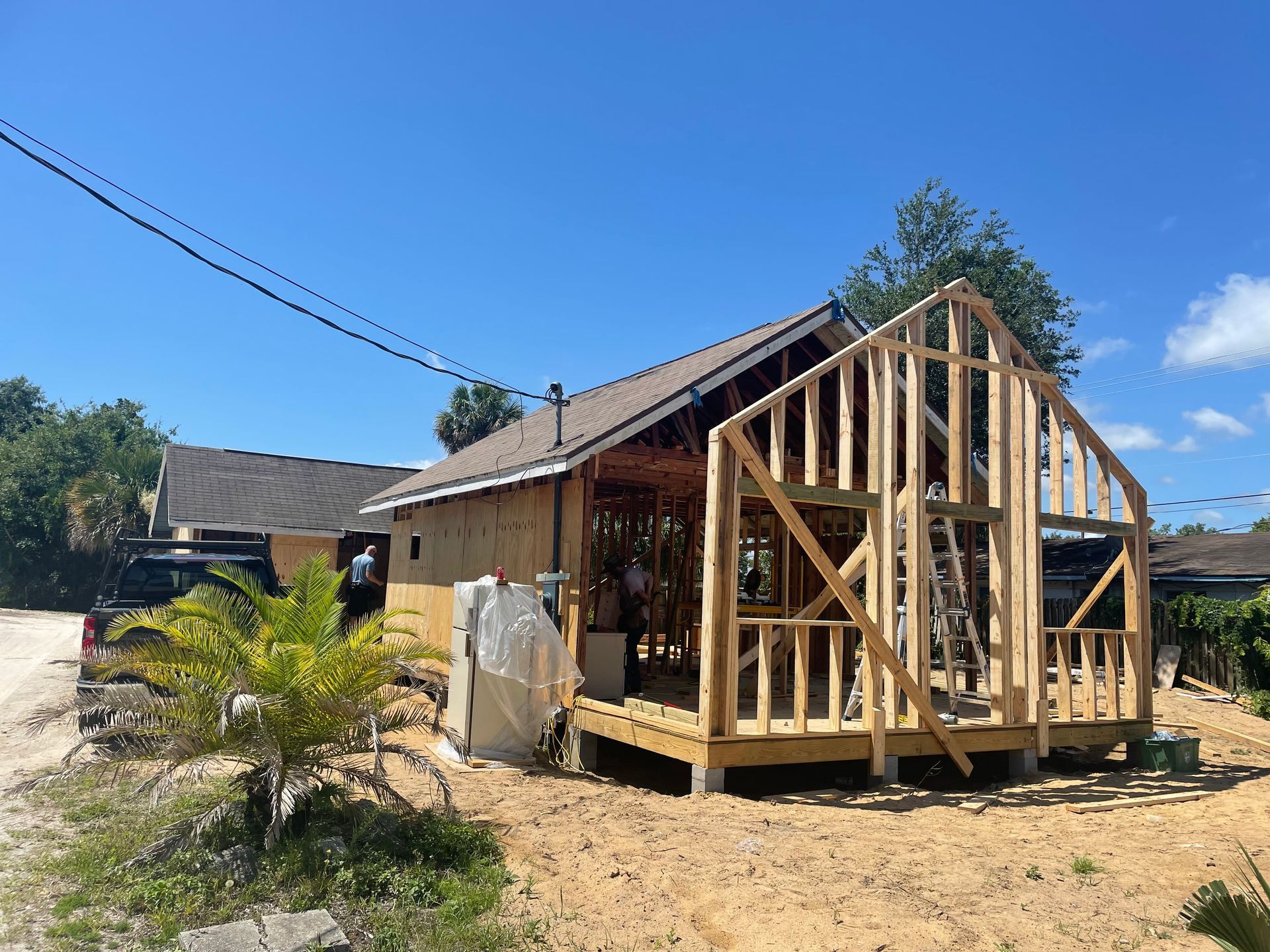 A house is being built with a wooden frame.
