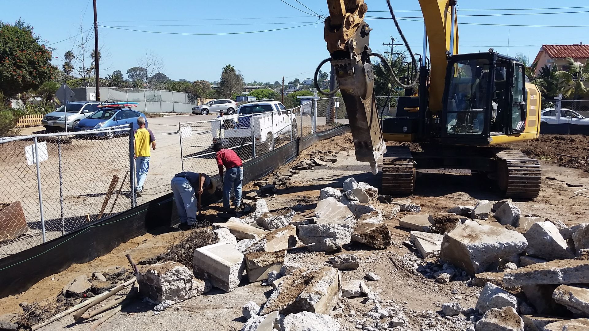 A group of construction workers are working on a construction site.